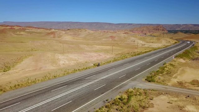 A man walking alone on the higway in Igdir, Turkey