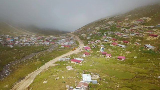 Foggy green plateau houses in nature, Ayder scenic, Rize, Turkey