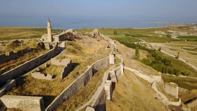 Historical Eastern fortress, Van Castle on rocky hill and mosques