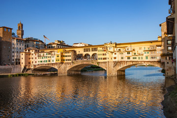 Fototapeta na wymiar Ponte Vecchio Bridge with Reflection at Sunset in Florence