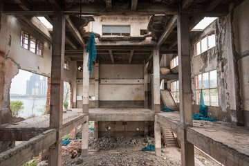 Fototapeta na wymiar Abandoned damaged factory concrete building space