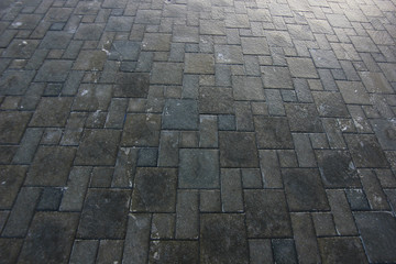 stone pavers on the square covered with ice
