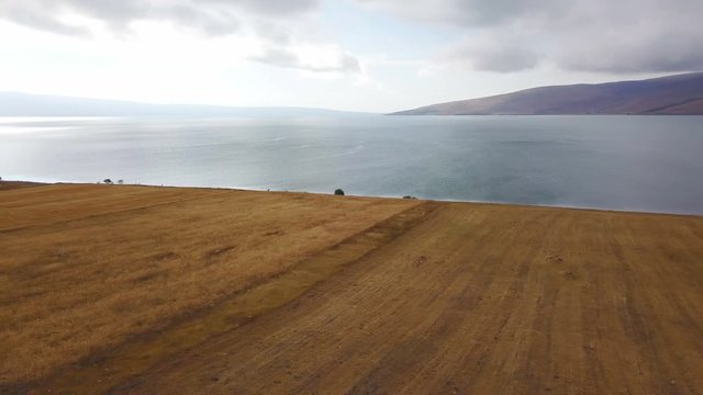 Flying on lake side road and farmland, Cildir, Ardahan, Turkey