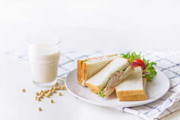 Healthy Sandwich : Stuffed crab sandwich with shrimps on white plate and soy milk.