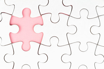 White puzzle over pink backround with missing pieces. Incomplete elements, solution search concept