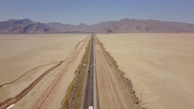 Dusty highway on the oriental yellow desert in Iran