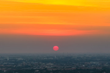 Sunrise sunset in the city with selective focus on the sun