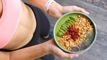 Concept Of Diet, Proper Nutrition And Health. Sport Woman Holding Smoothie Bowl