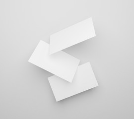 3d rendering of namecard isolated on gray background texture with shadow. Falling blank white business cards mockup template for display and brand image. Empty name card design presentation.