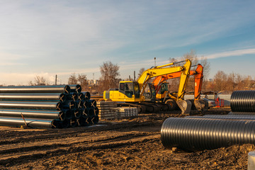 Yellow heavy earth mover. excavator machine on a construction site.