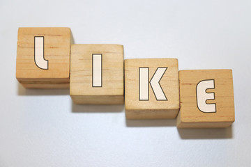 LIKE word made with building blocks isolated on white