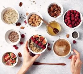 Healthy breakfast, oatmeal with raspberries, figs and nuts and seeds. The concept of a healthy lifestyle, diet. Top view