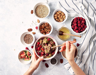 Healthy breakfast, oatmeal with raspberries, figs and nuts and seeds. The concept of a healthy lifestyle, diet. Top view