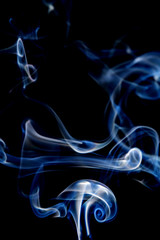 Abstract motion of white smoke isolated on a black background Can be modeled as hot food, smog, small clouds, and aromatic smoke.