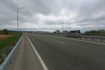 Beautiful country road in the summer. Asphalt or dirt road in the suburbs.