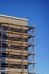 Construction site with building and scaffold