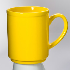 cup or colour ceramic mug on background new.