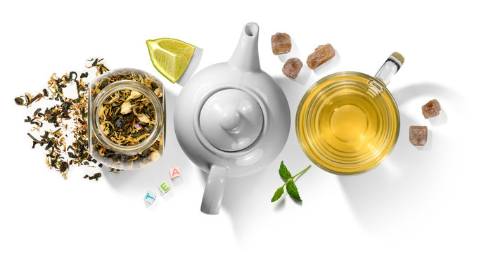 Green tea with aromatic additives and accessories. Top view on white background