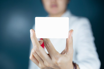Hand holding  a blank piece of paper. Close up  white business card.