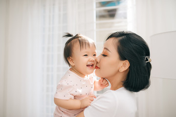 Single mom and daughter portrait. Happy family and people concept. Mother and Children day theme.