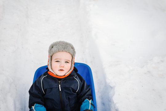 Toddler on sledge