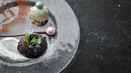 Chocolate dessert. Fondan. Top view, free space for your text. Rustic style.