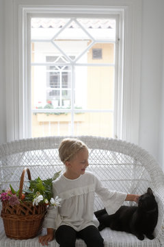 Girl petting cat