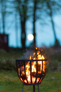 Firewood burning in metal container