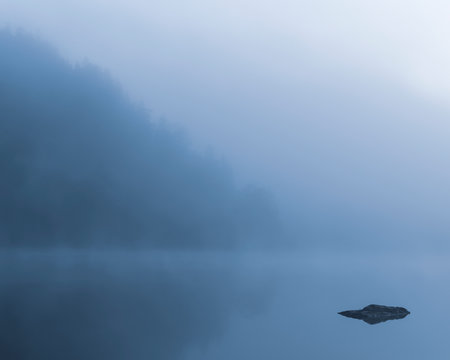 Lake in morning fog