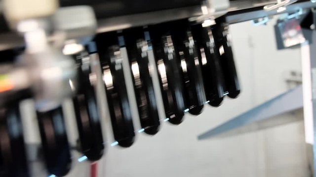 Blowing plastic bottles from PET preform blanks. A fragment of conveyor line, blowing plastic bottles from PET preform blanks