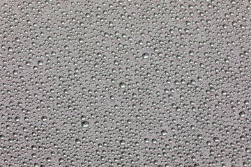 Grey surface with drops of rain water