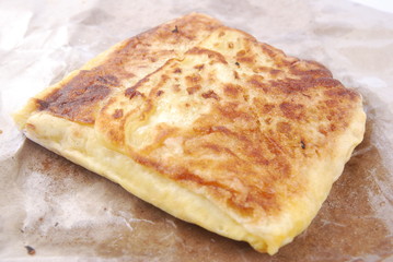Close up of murtabak on paper parchment