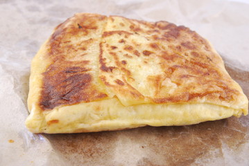 Close up of murtabak on paper parchment