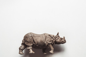 A toy rhino isolated against a white background