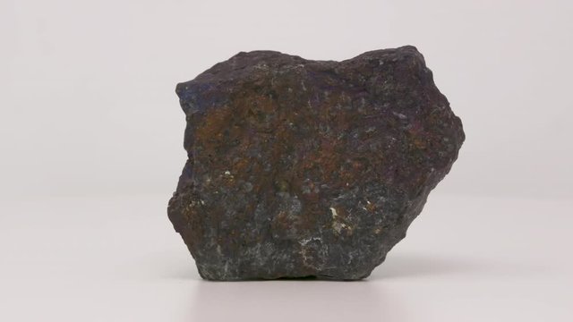 Very close of Bornite. Peacock ore specimen. Rotating back to front.