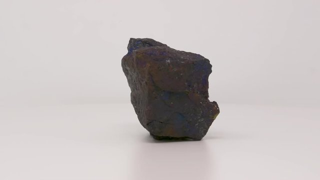 Close view of Bornite. Peacock ore specimen. Rotating completely. Looping.