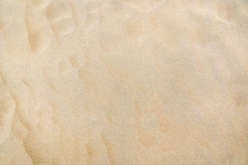 Fototapeta na wymiar Top view of sand texture on the beach as background.