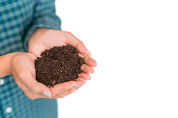 Close up hand of asian woman holding fertilizer compost in her hand isolate white background, Selective focus.