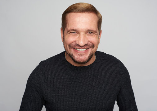 Middle Aged Bearded Man With Toothy Smile Isolated