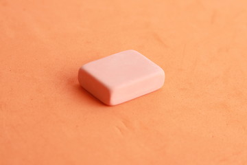 pink eraser on colorful background