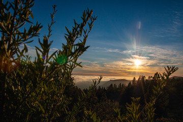 Impressive sunset over the mountains with the clouds underneath the mountain tops. Taken on the island of Tenerife