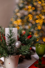 Fototapeta na wymiar Glasses and decorations on a Christmas table