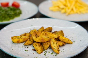 Fried potatoes with spices. Vegetarian food side dish or appetizer.