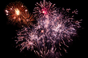 Red fireworks on black background for winter and new year festivals