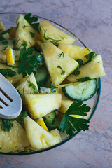 a plate of delicious summer lettuce from pineapple and cucumber closeup