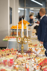 Mini burgers with meat and fish on the table prepared for the guests of the event.