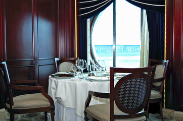 Formal and elegant restaurant dining room on luxury cruise ship liner during cruise with classic...