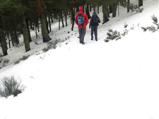 men climbing in the snow