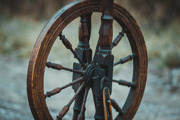 Old vintage antique peasant retro spinning wheel for weaving craft thread making