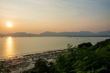 The sun sets on beautiful beach in Thailand, Phuket.